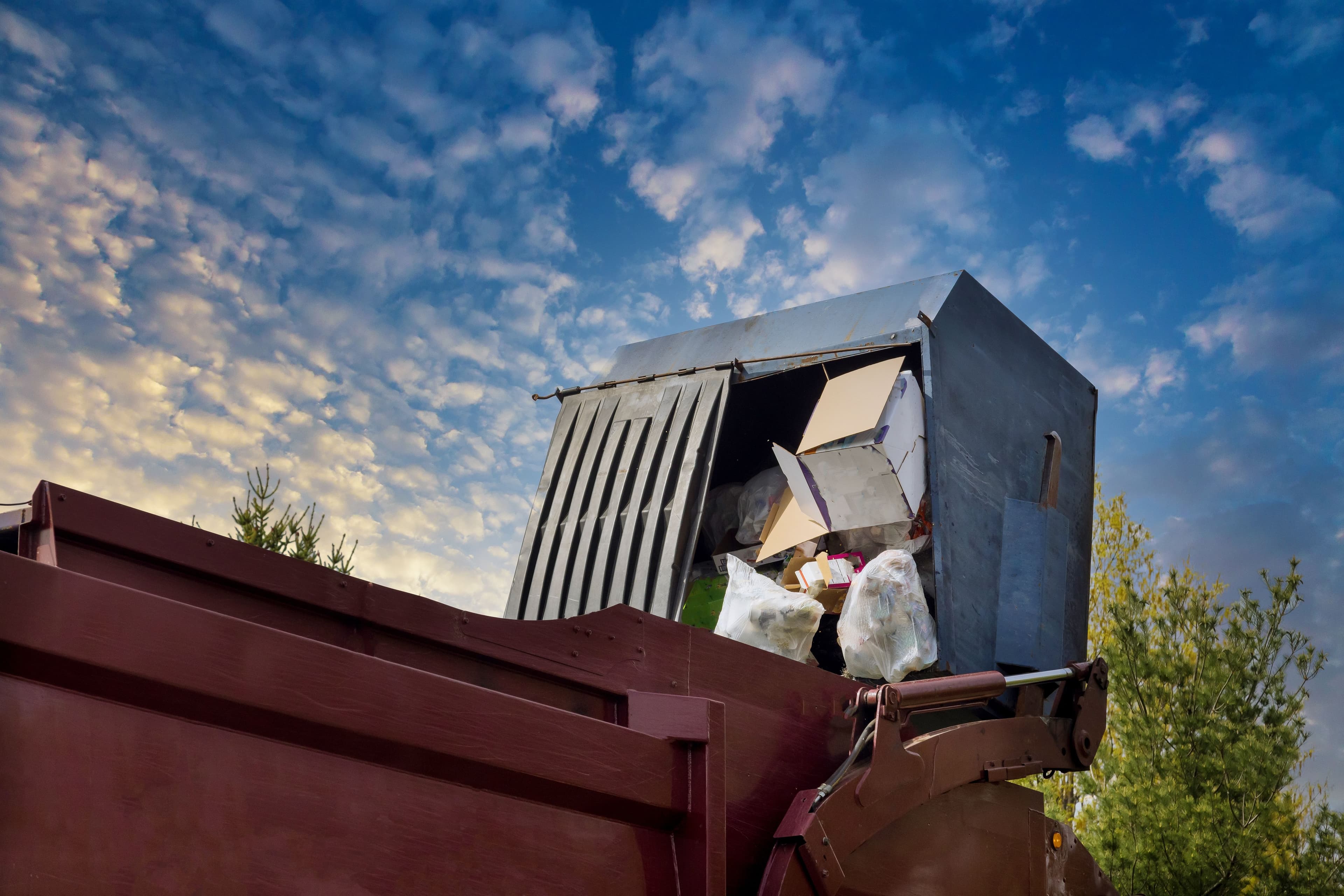 lorry-truck-loading-a-skip-waste-management-contai