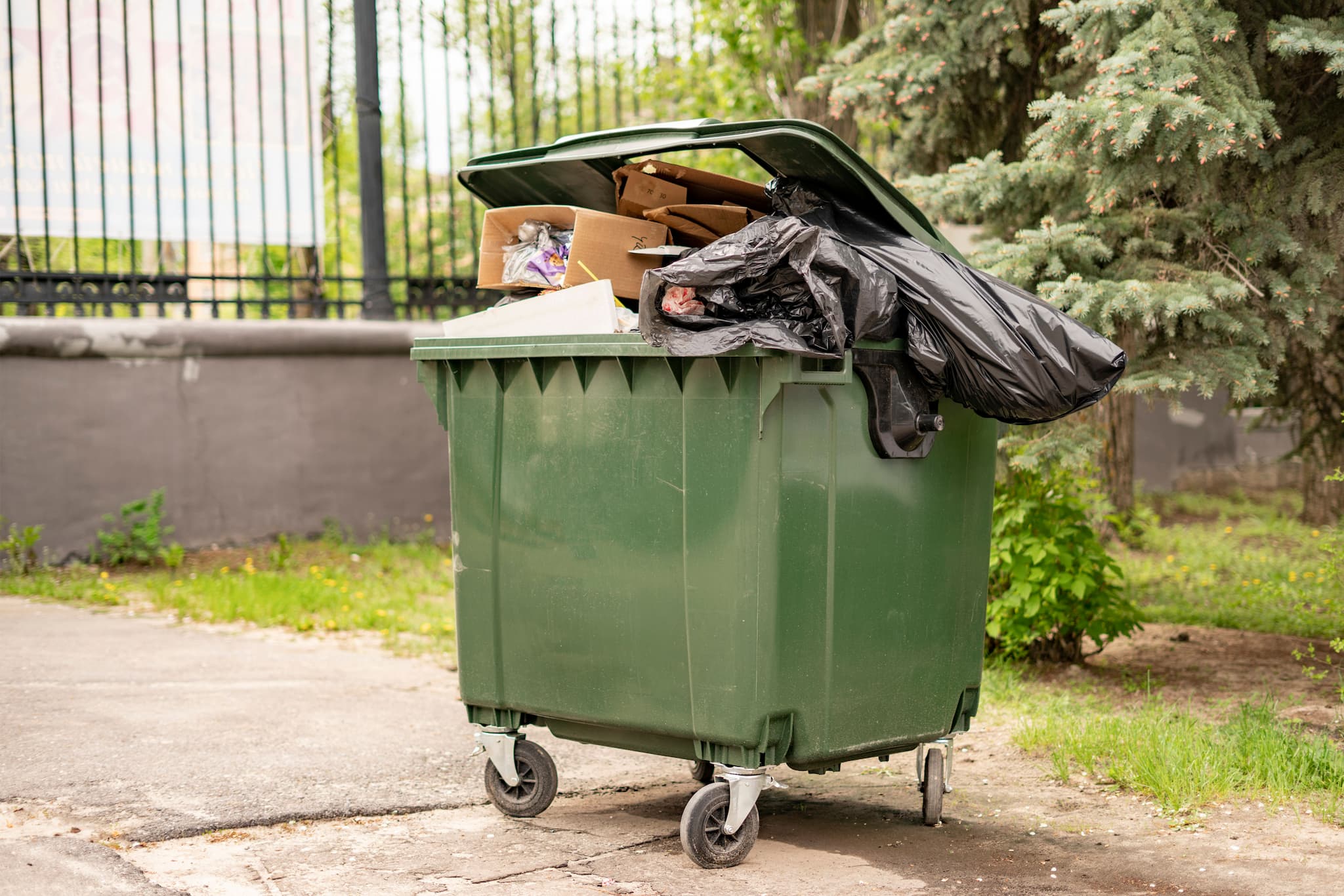 metal-green-old-fulled-with-trash-garbage-containe